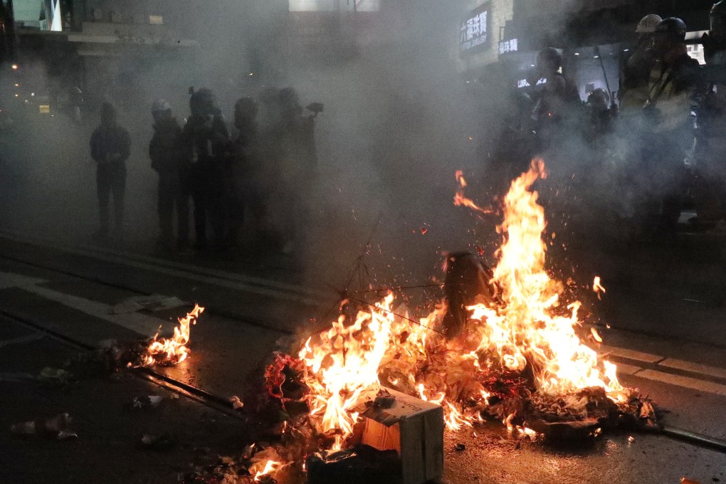 Protesters set fire to a barricade in Causeway Bay in August, 2019. Photo: Felix Wong