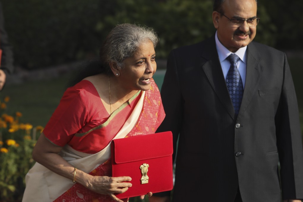 Indian Finance Minister Nirmala Sitharaman is pictured in February carrying the annual federal budget in a red case. Photo: AP