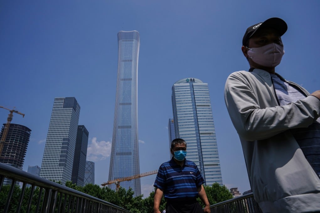 Pedestrians in the central business district of Beijing. Several Chinese banks will report their earnings on Friday. Photo: EPA-EFE