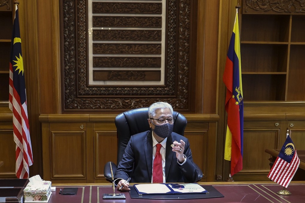 Malaysia's new Prime Minister Ismail Sabri Yaakob is seen in his office in Putrajaya. He met with opposition leaders on Wednesday. Photo: EPA-EFE