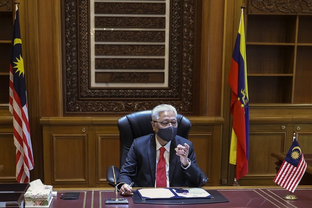 Malaysia's new Prime Minister Ismail Sabri Yaakob is seen in his office in Putrajaya. He met with opposition leaders on Wednesday. Photo: EPA-EFE