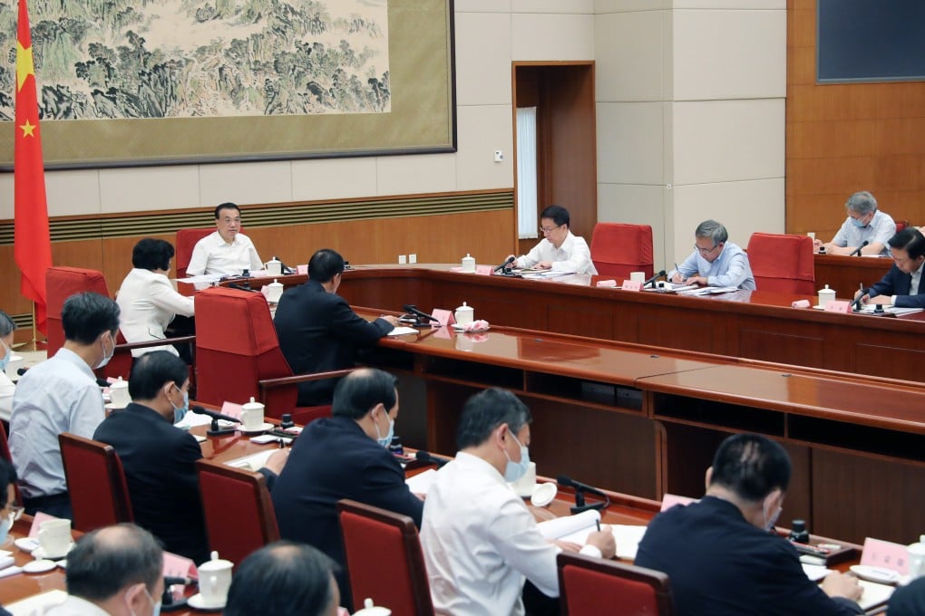 Premier Li Keqiang, vice-premiers Han Zheng, Hu Chunhua and Sun Chunlan, as well as State Councillor Wang Yong, who is in charge of the country’s state-owned enterprises, attend the meeting on Monday in Beijing. Photo: Xinhua