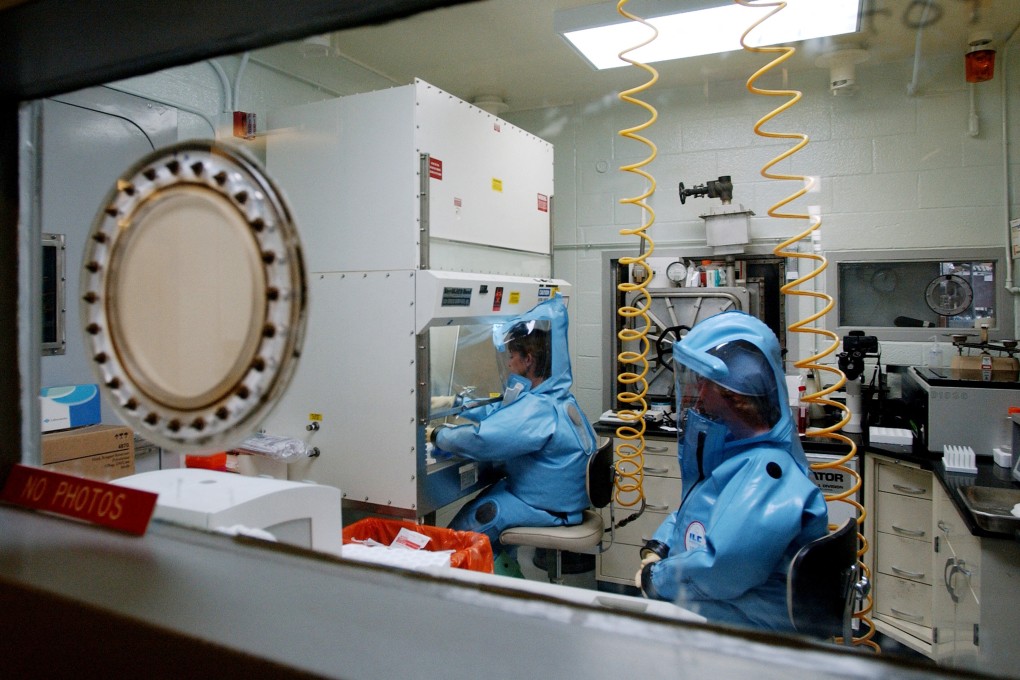 Work in progress at the US Army Medical Research Institute of Infectious Diseases at Fort Detrick, Maryland, in 2002. Research at the facility, equipped to handle dangerous pathogens such as Ebola and plague, was suspended in 2019 over safety concerns. Photo: AFP