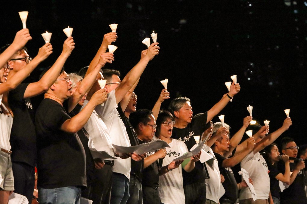 Members of the Hong Kong Alliance in Support of Patriotic Democratic Movements of China raise candles at a 2019 vigil marking the anniversary of the Tiananmen Square crackdown. Photo: Felix Wong