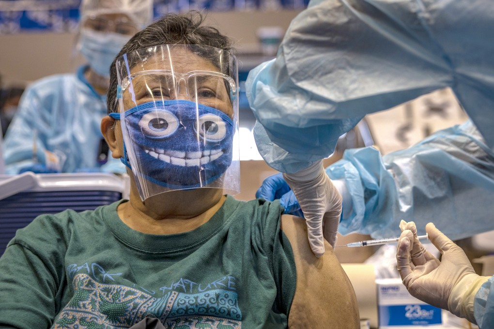 A woman receives a Covid-19 vaccine in Makati, Metro Manila, Philippines. Photo: Getty Images