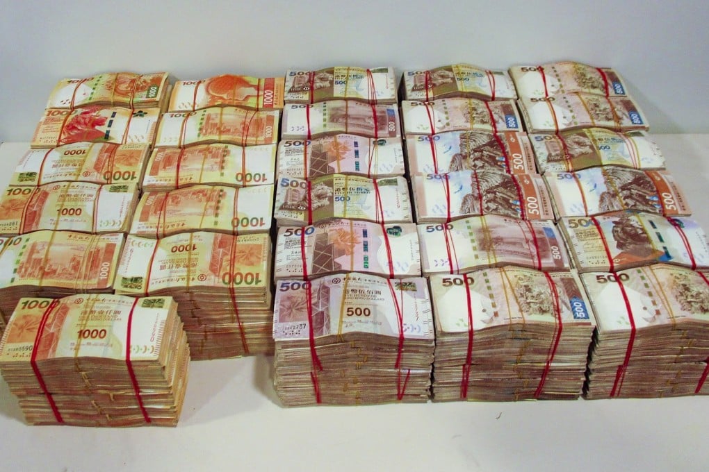 Cash seized in an operation that broke up a money-laundering ring engaged in smuggling criminal proceeds across the Hong Kong-Zhuhai-Macau Bridge. Photo: Handout