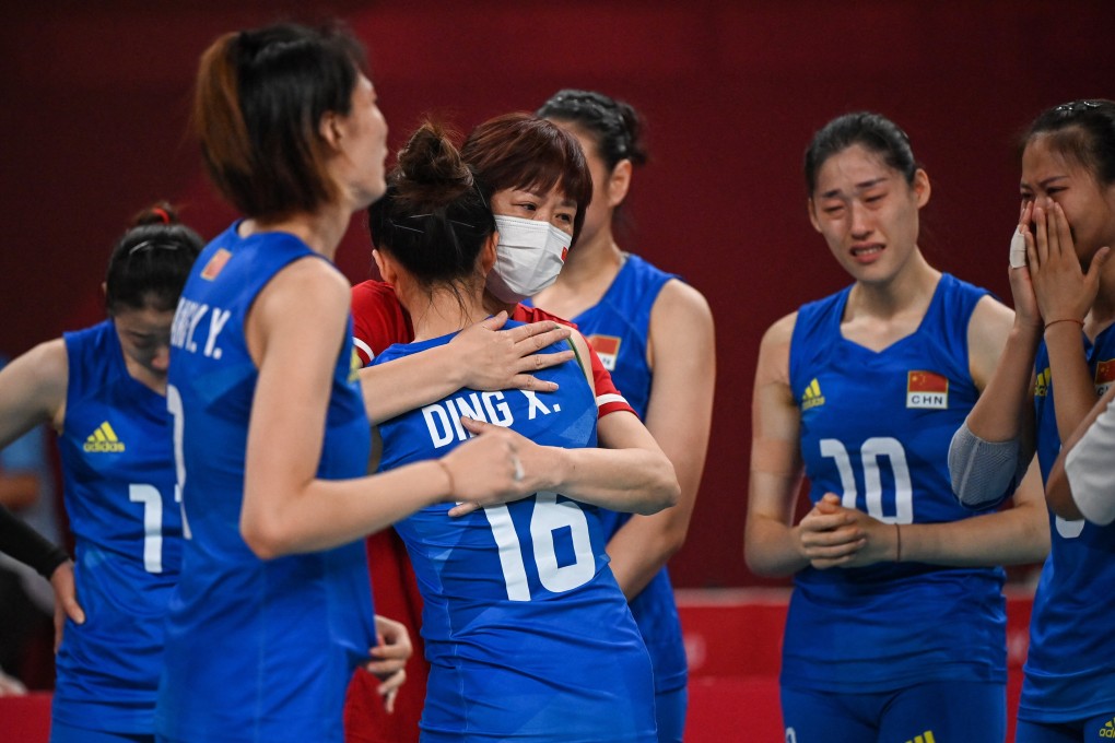 China's Ding Xia hugs head coach Lang Ping after their women's preliminary round pool B volleyball match between China and Argentina during the Tokyo 2020 Olympic Games at Ariake Arena in Tokyo. Photo: AFP