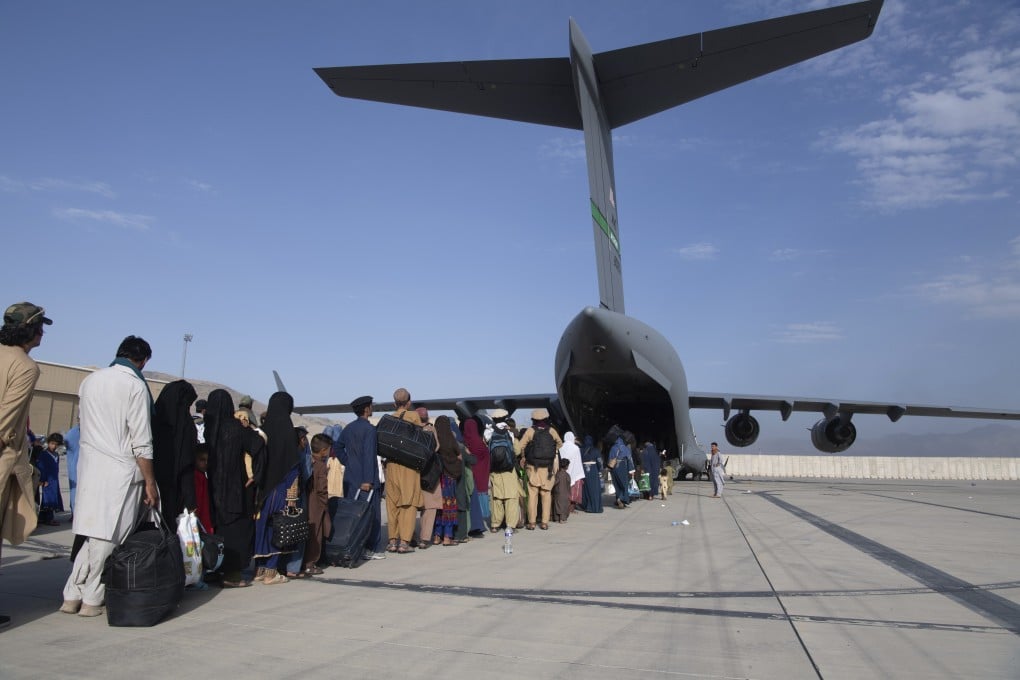 People board a US Air Force C-17 Globemaster at Hamid Karzai International Airport in Kabul. Photo: US Air Force
