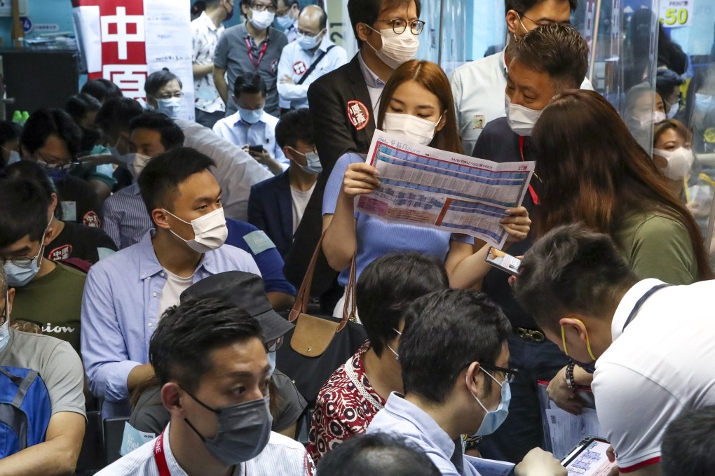 Property buyers and sales agents at Wang On Properties’ sales office in Mong Kok, vying for The Met.Azure development on 14 August 2021. Photo: Edmond So