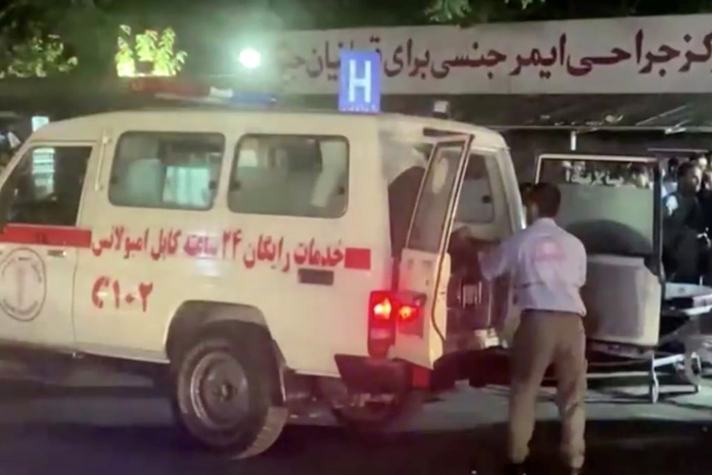 People arrive at a hospital after the attack at Kabul airport on Thursday. Photo: Reuters TV via Reuters