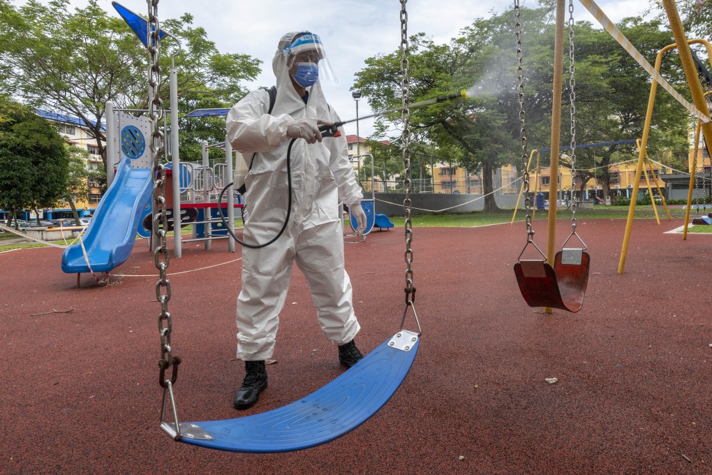 A worker sanitises a playground in the outskirts of Kuala Lumpur. Photo: Xinhua