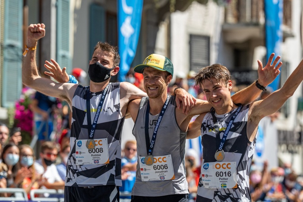 The top three male finishers in the UTMB OCC. Photo: Alex Reshikov