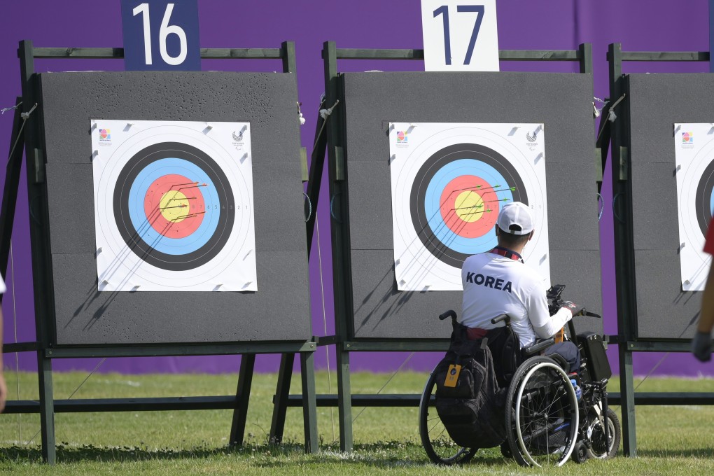 Scores are checked in the archery of the Tokyo 2020 Paralympic Games in Yumenoshima Ranking Field. Photo: EPA