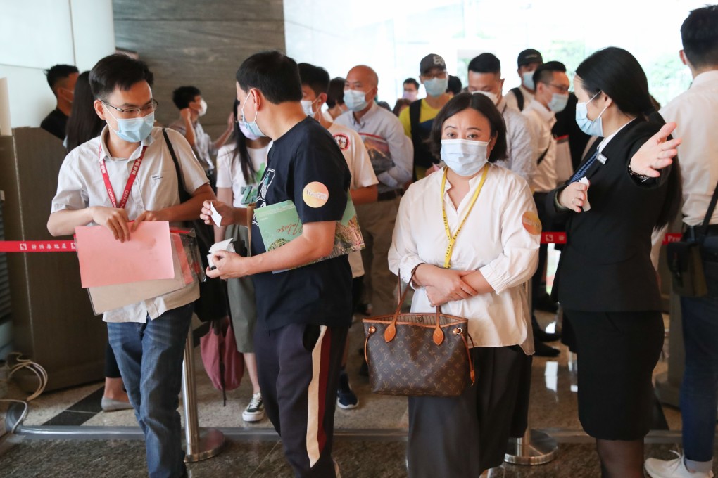 Potential Buyers line up at the sales office of SHKP's Wetland Seasons Bay at International Commerce Centre (ICC) on August 28, 2021. Photo: Edmond So