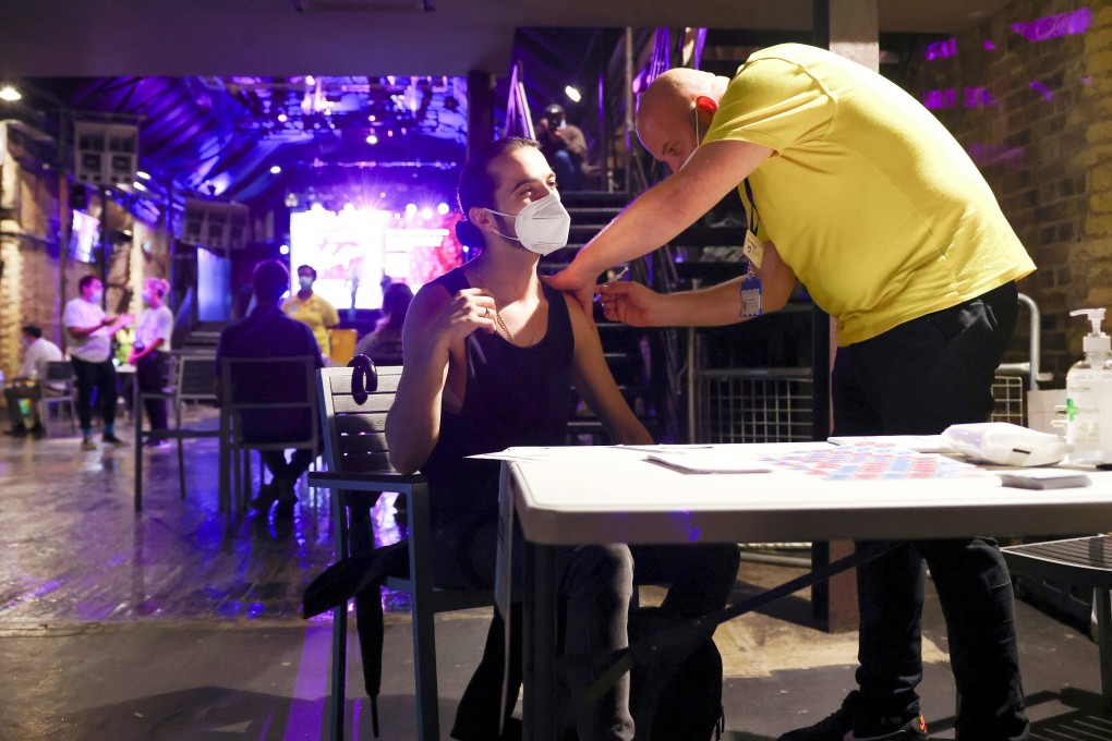 A man gets vaccinated against Covid-19 in London. Photo: Reuters