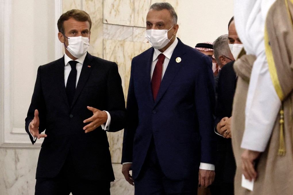 French President Emmanuel Macron, left, and Iraq’s Prime Minister Mustafa al-Kadhimi in Baghdad on Saturday. Photo: AFP