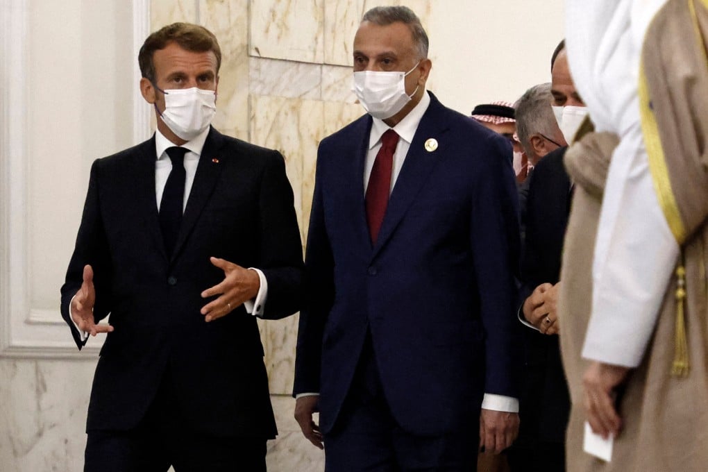 French President Emmanuel Macron, left, and Iraq’s Prime Minister Mustafa al-Kadhimi in Baghdad on Saturday. Photo: AFP