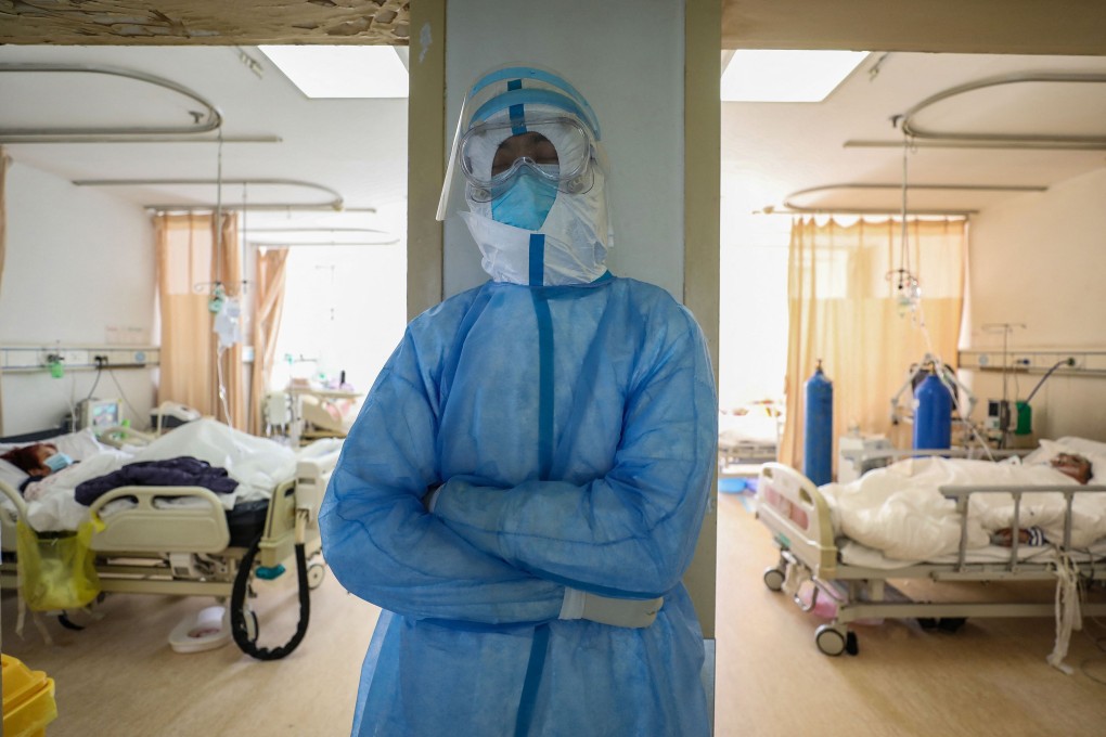 The virus was first detected in the Chinese city of Wuhan in late 2019, but its origins remain unknown. Photo: STR/AFP