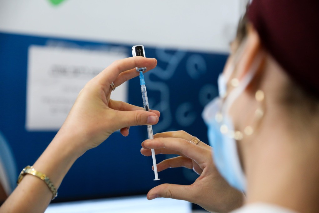 A nurse prepares a Covid-19 vaccine shot in Jerusalem. Photo: EPA-EFE
