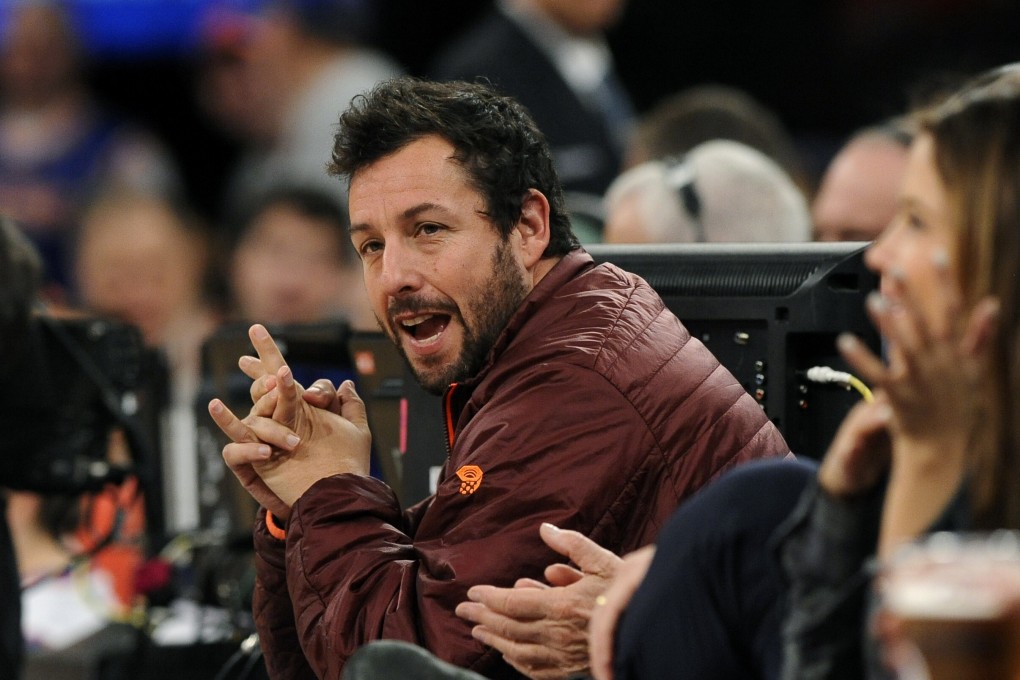 Actor Adam Sandler attends an NBA basketball game between the Boston Celtics and the New York Knicks in 2013. Photo: AP