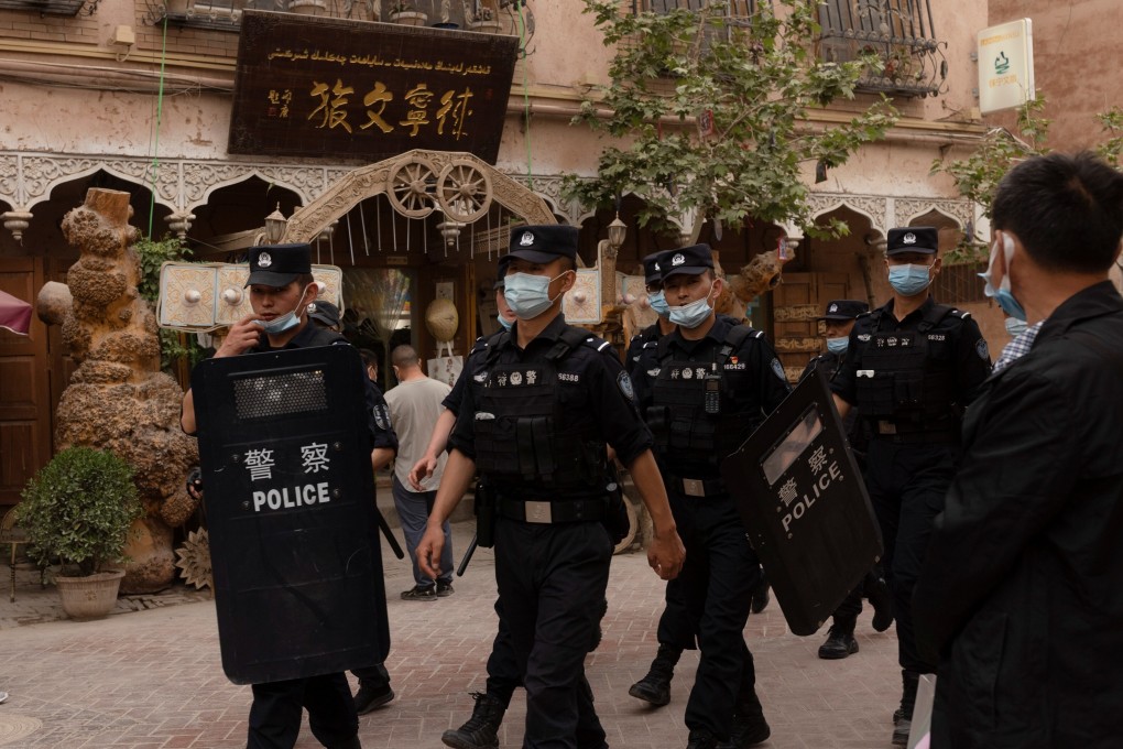 Police officers patrol streets of Kashgar in China’s Xinjiang region, which shares a border with Afghanistan. Photo: Reuters