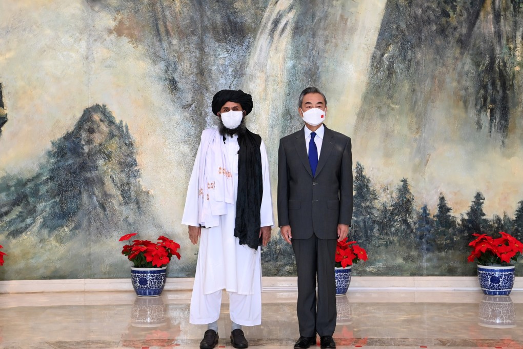 Chinese State Councillor and Foreign Minister Wang Yi with Mullah Abdul Ghani Baradar, political chief of Afghanistan's Taliban, in Tianjin, China, in July. Photo: Xinhua