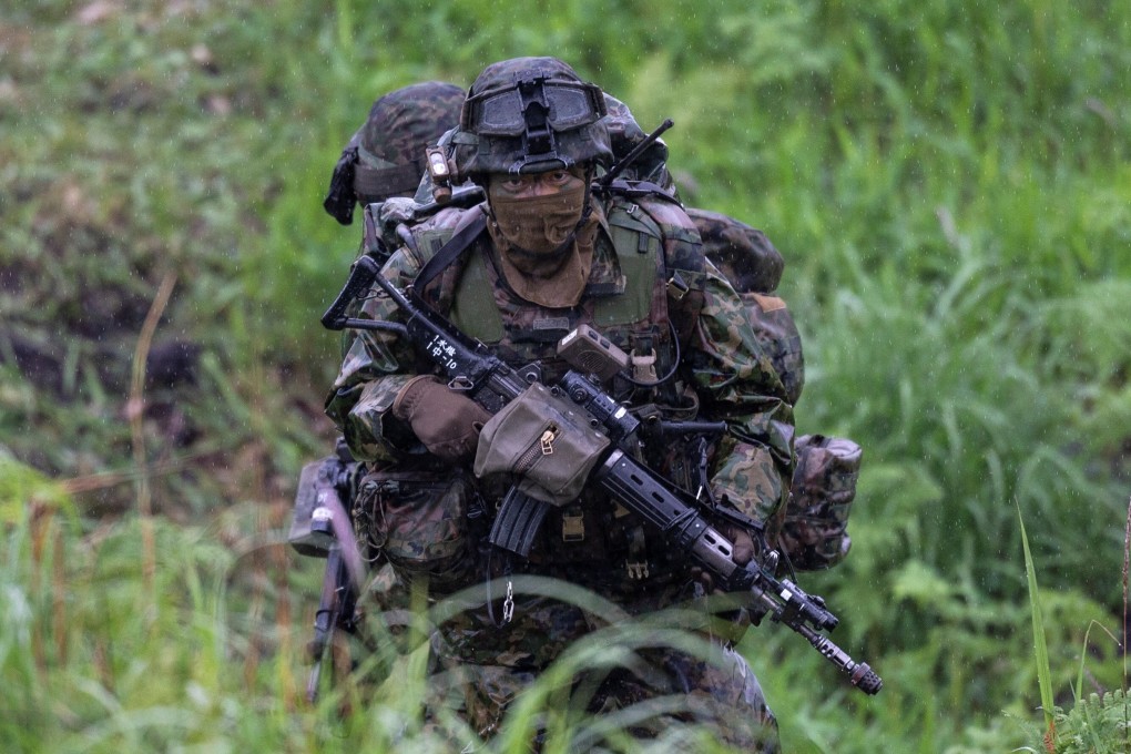 A Japanese soldier trains during a joint military drill with French and US forces in Japan’s Miyazaki prefecture in May. Photo: Reuters