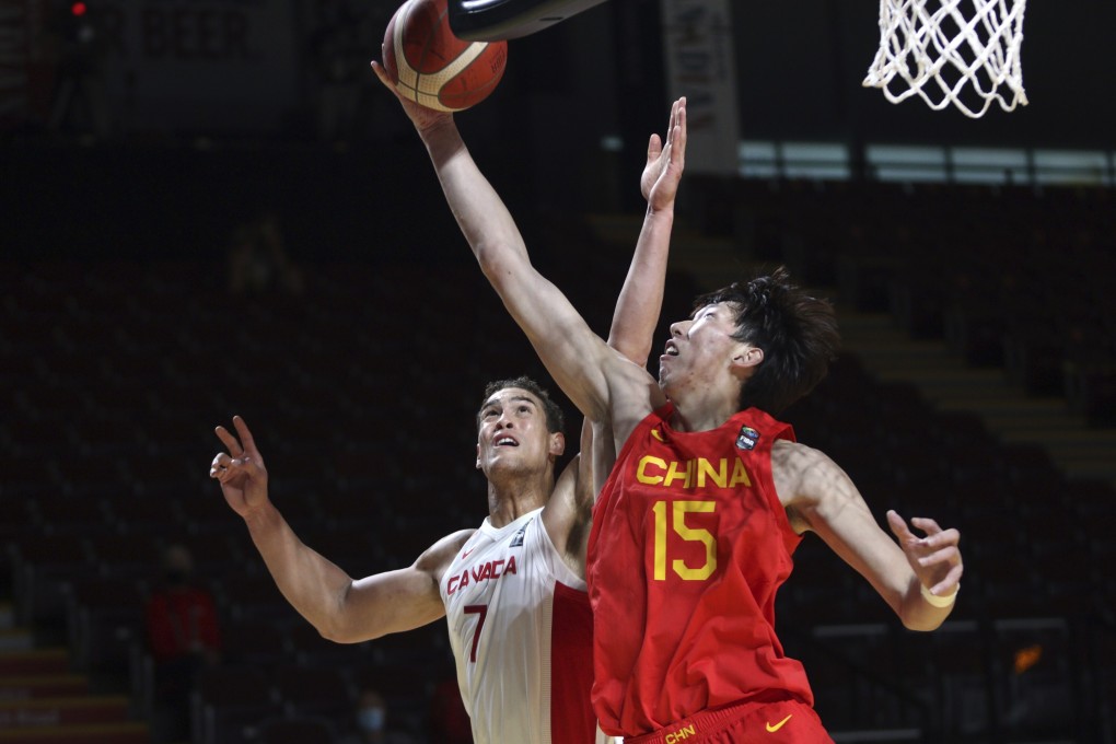 China‘s Qi Zhou battles with Canada‘s Dwight Powell during the first half of a FIBA men’s Tokyo 2020 Olympic Games basketball qualifying game in June. Photo: AP