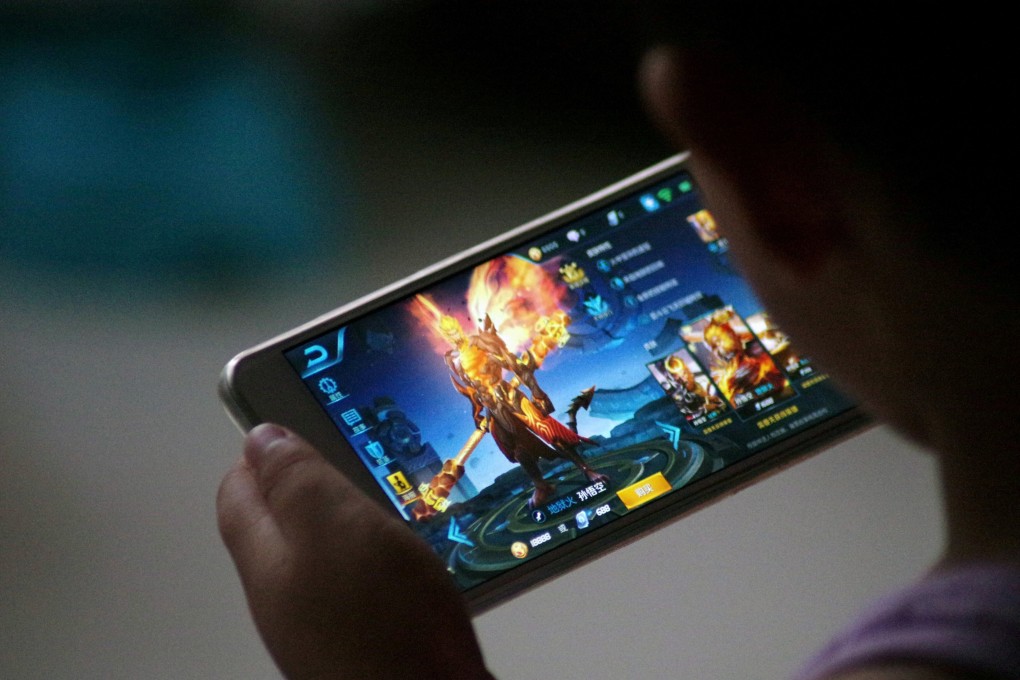 A child plays Tencent’s hugely popular Honour of Kings game. Photo: Reuters