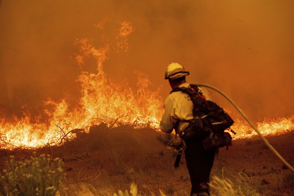 A firefighter battles the Caldor Fire near South Lake Tahoe, California on Tuesday. Photo: AP