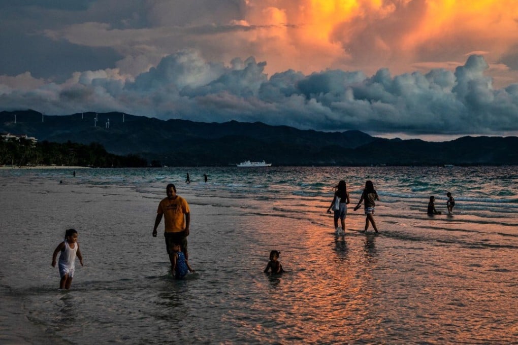 People swim at White Beach on Boracay island in October 2020. Photo: Getty Images