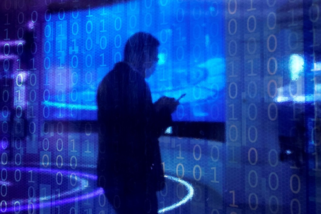 A man looking at a phone is seen through a digitally decorated glass during the World Internet Conference in Wuzhen, Zhejiang province, in November 2020. Photo: Reuters