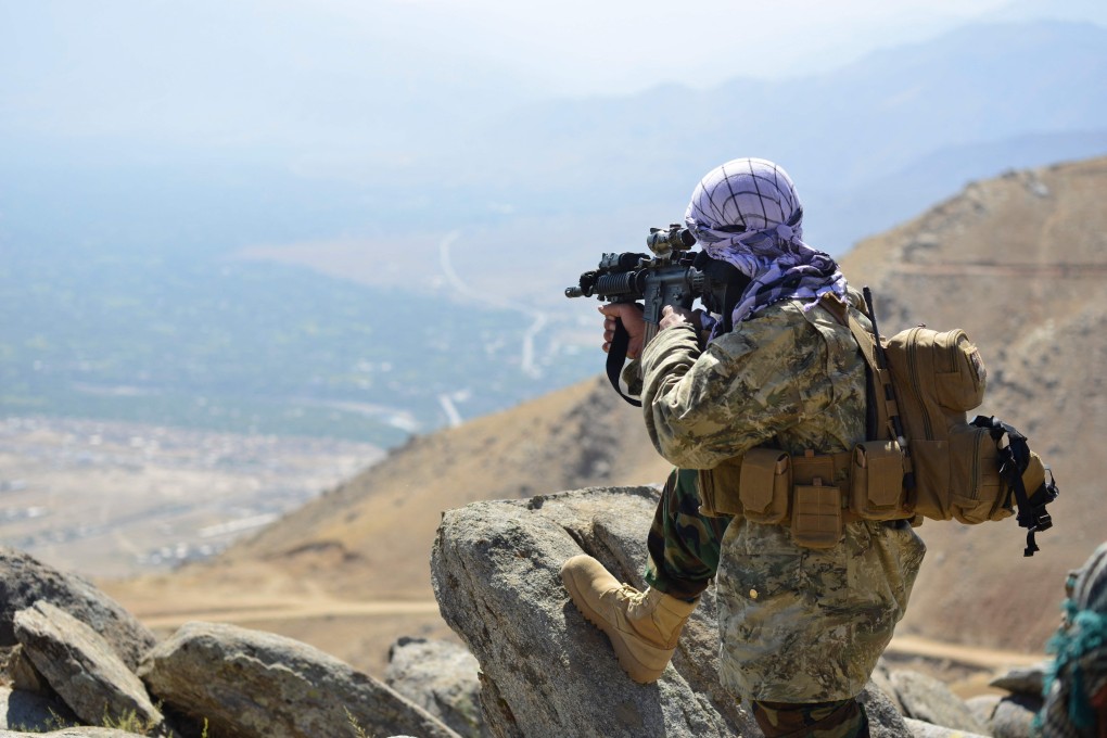 An Afghan resistance fighter takes a position on a hilltop in the Darband area in Anaba district, Panjsher province. Photo: AFP