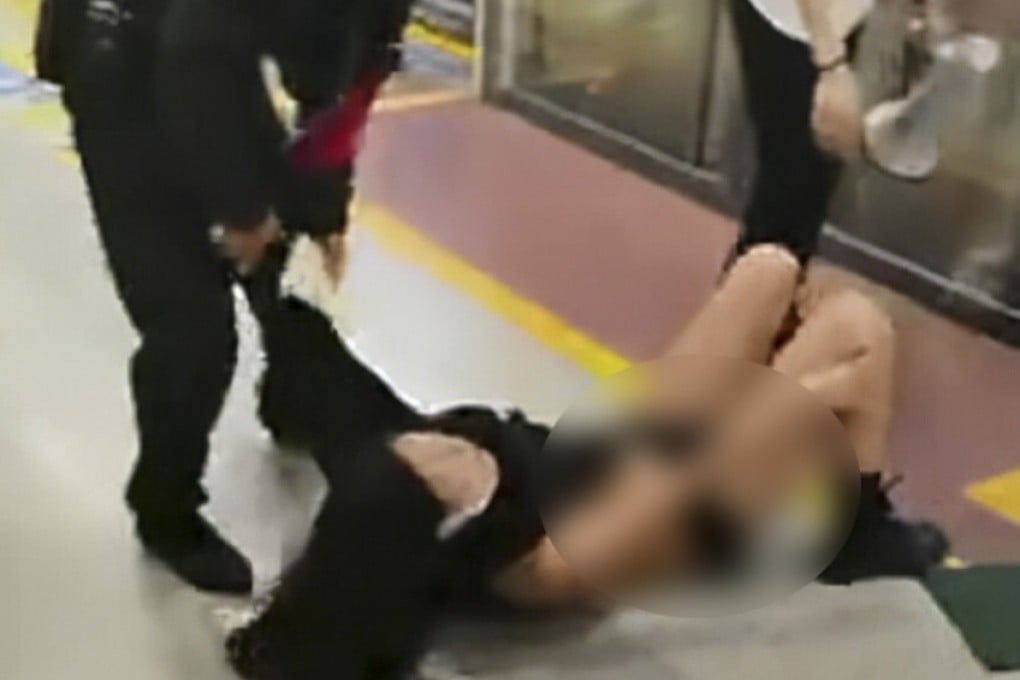 This image is from a video taken on the Xian subway and shows a guard violently dragging a woman off a train after a row with passengers. Photo: Handout