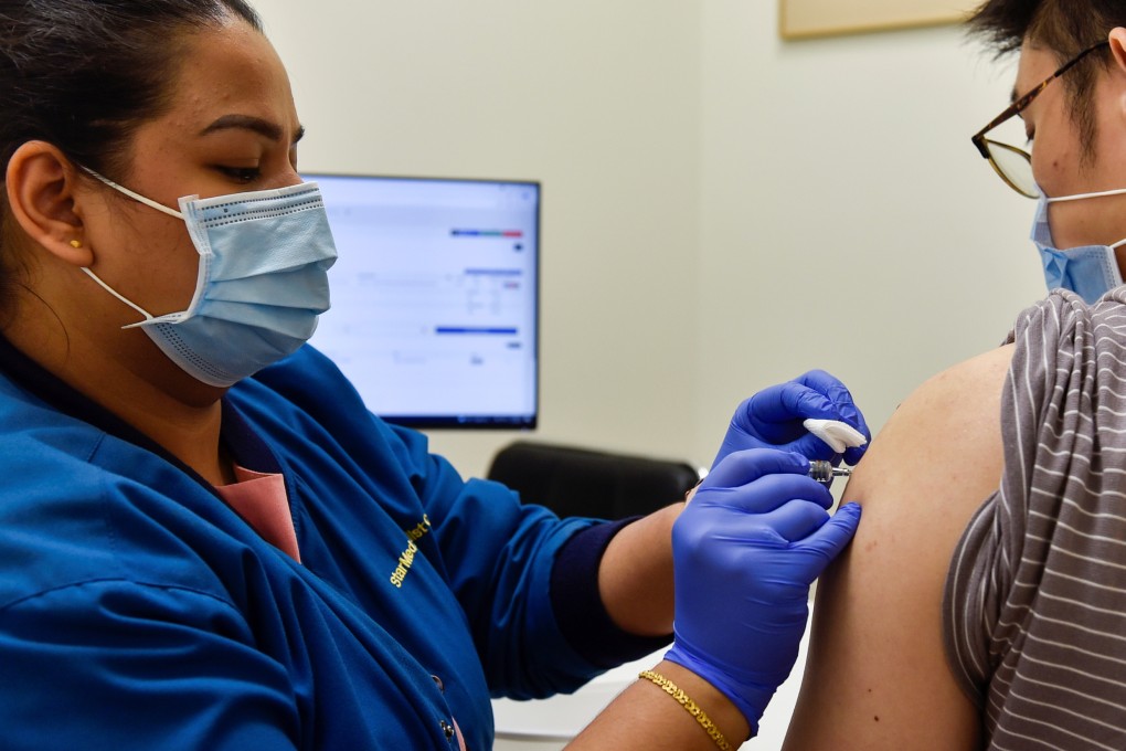 A nurse at StarMed Specialist Centre in Singapore administers a coronavirus vaccine. Photo: Reuters