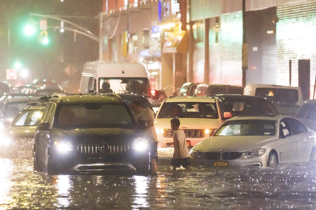 Cars stuck on a street flooded by heavy rain in the Queens borough of New York. Photo: EPA
