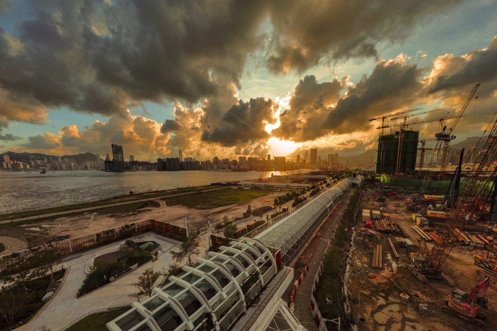 Sunset over Hong Kong’s former Kai Tak airport runway, which has been transformed into 1.4-kilometre Kai Tak Sky Garden (foreground) pedestrian walkway, on 22 May 2021. Photo: Martin Chan