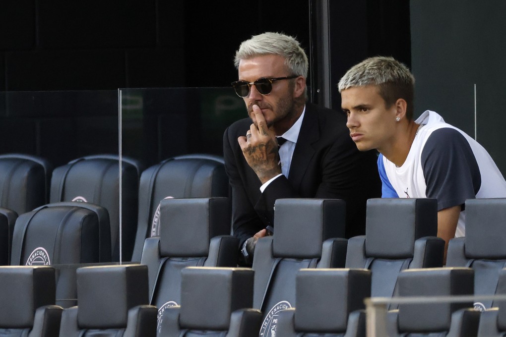 David Beckham, left, with his son Romeo in Fort Lauderdale, Florida. Photo: AP