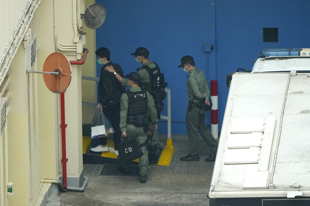 One of the suspects, Cheung Chun-fu (left) is taken to Lai Chi Kok Reception Centre after the court hearing. Photo: Handout