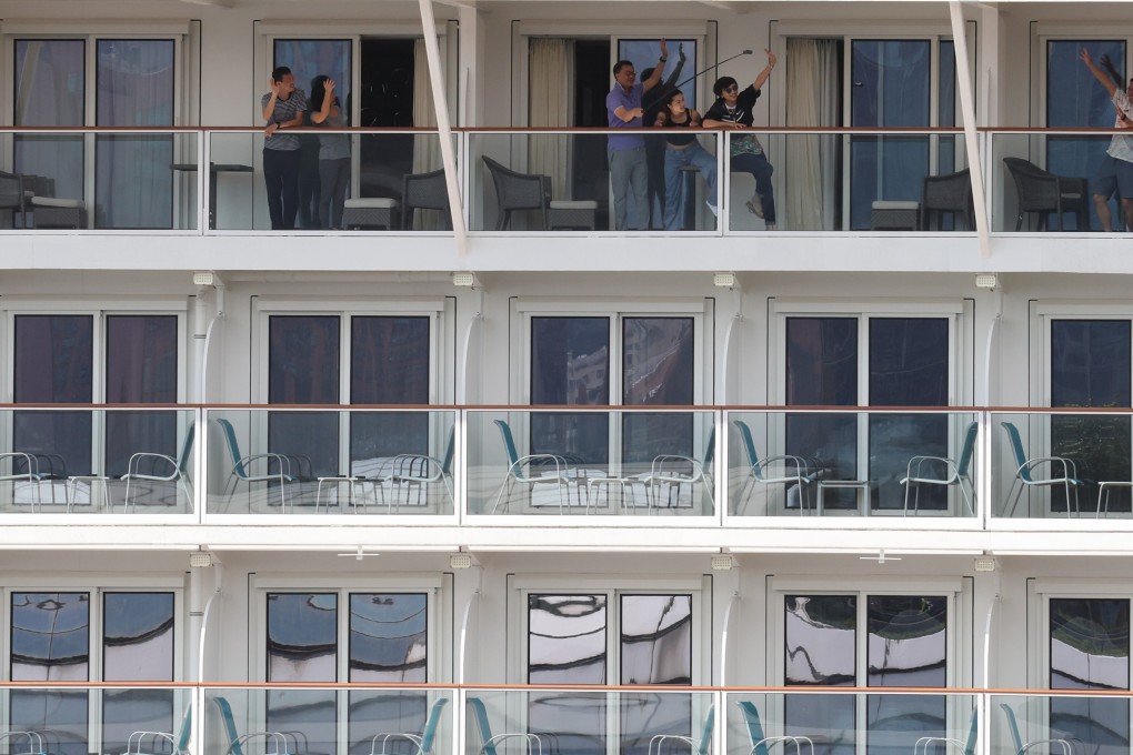 The Genting Dream cruise ship returns to Kai Tak Cruise Terminal with 1,070 passengers aboard having sailed the high seas for three days and two nights without stopping. Photo: Nora Tam