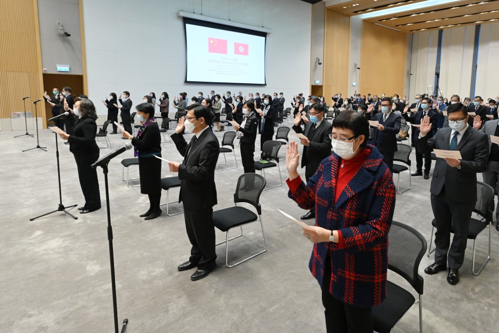 Hong Kong civil servants swear an oath of allegiance to the city. Photo: Handout