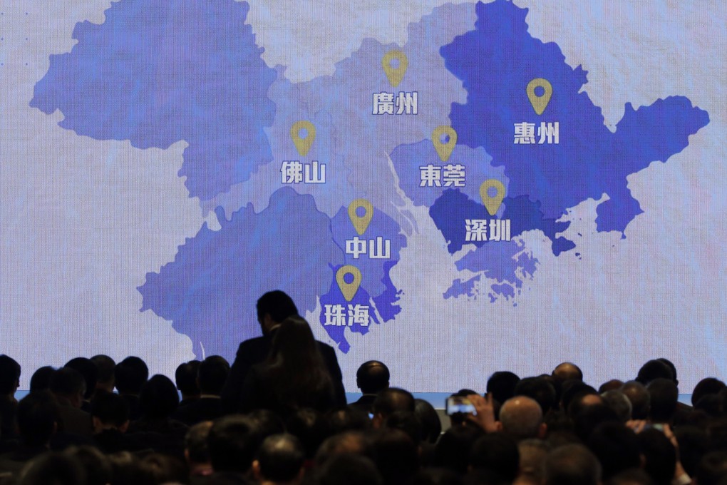 A screen shows a map of the Greater Bay Area. Bankers and investment advisers are gearing up to sell products under the Wealth Management Connect. Photo: AP Photo
