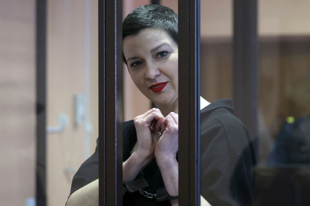 Maria Kolesnikova gestures making a heart shape inside the defendants’ cage during her verdict hearing in Minsk, Belarus on Monday. Photo: AFP