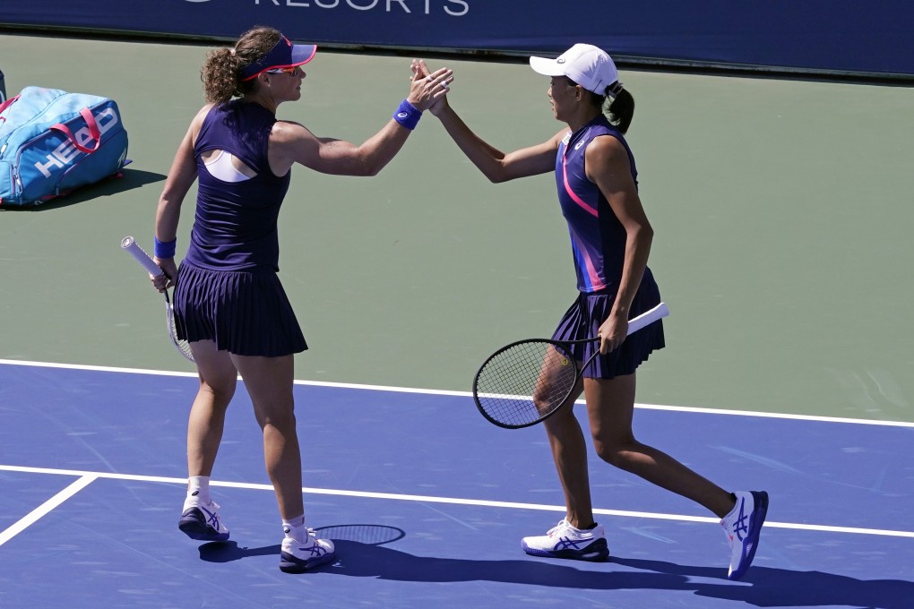 Samantha Stosur of Australia, and Zhang Shuai of China, celebrate after winning a set against Japanese pairing Shuko Aoyama and Ena Shibahara in the US Open women’s doubles third round. Photo: AP