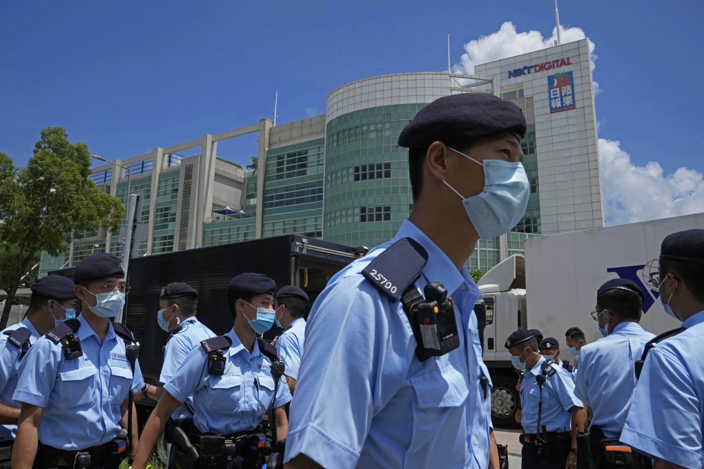 Police arrested several senior Apple Daily executives in June. Photo: AP