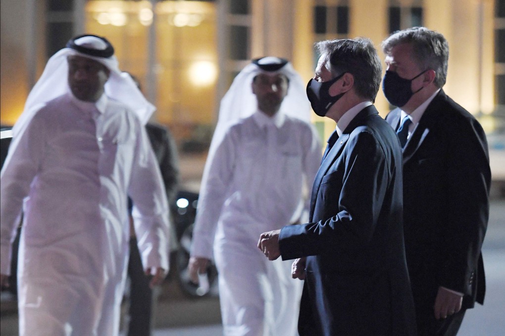 US Secretary of State Antony Blinken, second right, walks alongside US Ambassador John Desrocher upon arrival at Old Doha Airport in Qatar’s capital on Monday. Photo: AFP