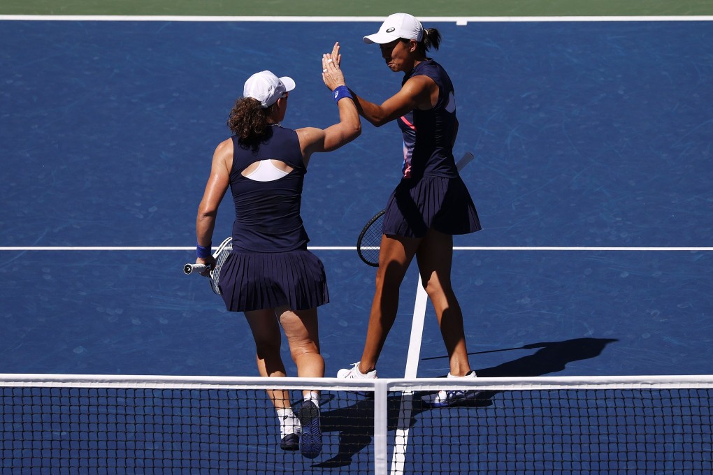 Zhang Shuai of China and Samantha Stosur of Australia celebrate during their US Open women’s doubles match against Caroline Dolehide of the US and Storm Sanders of Australia. Photo AFP