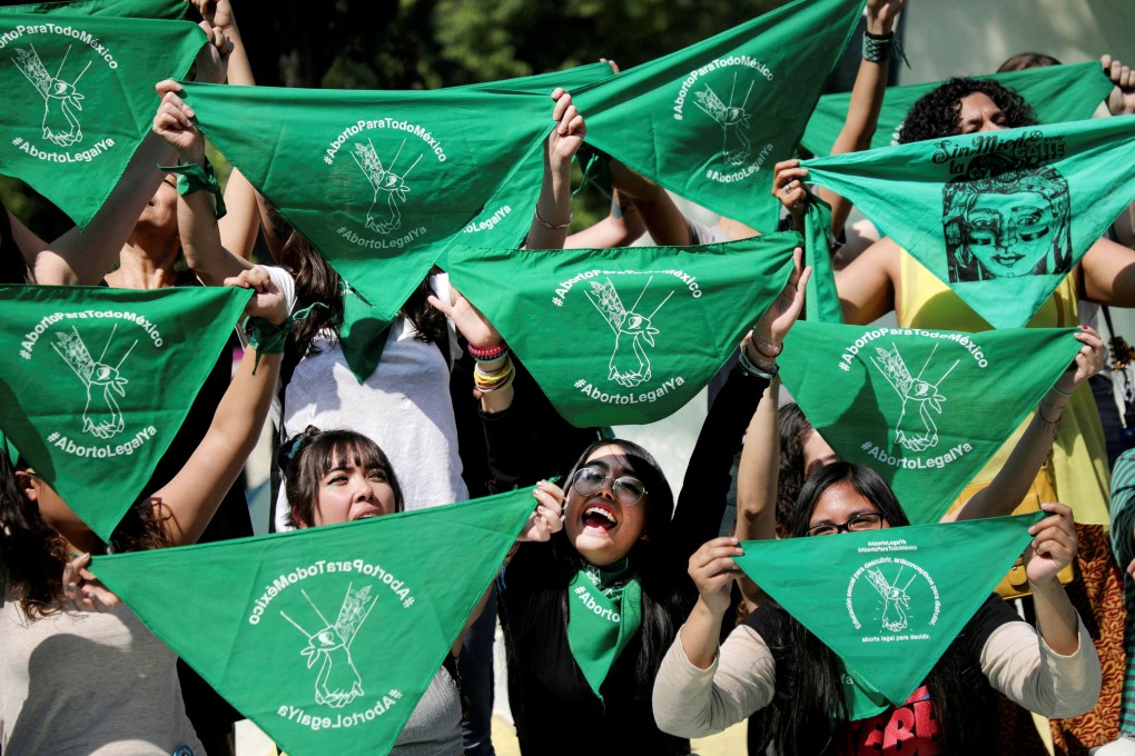 Women hold green handkerchiefs during a protest in support of legal and safe abortion in Mexico City in February 2020. Photo: Reuters