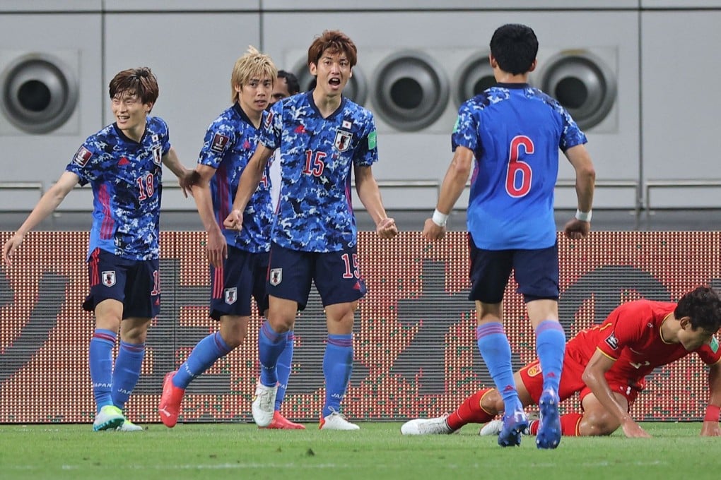 Japan's forward Yuya Osako celebrates his opening goal during the Qatar 2022 Fifa World Cup Asian Qualifiers match between China and Japan at the Khalifa International stadium in Doha, Qatar. Photo: AFP