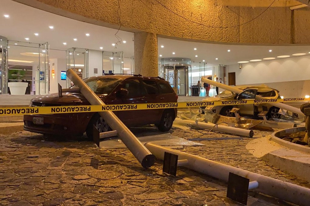 Damaged cars outside a hotel after a quake hit near Acapulco, Mexico. Photo: AFP